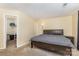 Spacious bedroom featuring plush carpeting, closet, and ample natural light at 6011 Treetop Ct, Charlotte, NC 28212
