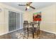 Charming dining area featuring a modern table, stylish chairs, and sliding glass door at 6011 Treetop Ct, Charlotte, NC 28212
