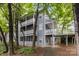 Inviting condo exterior with multiple balconies and lush greenery at 6011 Treetop Ct, Charlotte, NC 28212