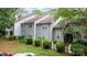 Well-manicured lawn with a white picket fence frames this lovely home's exterior at 6011 Treetop Ct, Charlotte, NC 28212