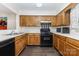 Well-equipped kitchen with modern appliances, ample counter space, and sleek cabinetry at 6011 Treetop Ct, Charlotte, NC 28212