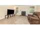 Spacious living room with fireplace, comfortable seating, and ample natural light at 6011 Treetop Ct, Charlotte, NC 28212