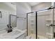 Bathroom with a walk-in shower, white cabinets, and a modern sink at 6027 Veld Ct # 82, Charlotte, NC 28215