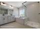 Modern bathroom boasting a soaking tub, separate shower, and double vanity at 6027 Veld Ct # 82, Charlotte, NC 28215