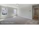 Bright bedroom offering neutral walls, plush carpeting, and neighborhood views at 6027 Veld Ct # 82, Charlotte, NC 28215
