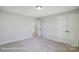 Bright, airy bedroom with a view into the closet and double doors for plenty of storage at 6027 Veld Ct # 82, Charlotte, NC 28215