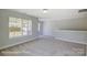 Neutral carpeting and light walls fill the area, creating a welcoming and open atmosphere at 6027 Veld Ct # 82, Charlotte, NC 28215