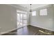Bright dining area with sliding glass doors and wood floors at 6027 Veld Ct # 82, Charlotte, NC 28215