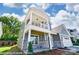 Beautifully designed two-story home with stone accents, a cozy balcony, and a well-maintained front yard at 6027 Veld Ct # 82, Charlotte, NC 28215