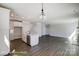 Open-concept kitchen with a large island, white cabinetry, stainless steel appliances, and adjoining dining room at 6027 Veld Ct # 82, Charlotte, NC 28215