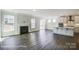 Spacious living room with a fireplace, hardwood floors, and plenty of natural light at 6027 Veld Ct # 82, Charlotte, NC 28215