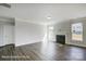 Bright living room with hardwood floors, a fireplace, and multiple windows for natural light at 6027 Veld Ct # 82, Charlotte, NC 28215