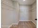 Spacious walk-in closet featuring carpeted floors, white base trim, and wire shelving on all sides at 6027 Veld Ct # 82, Charlotte, NC 28215