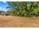 Homes with spacious backyards, lush greenery, and mature trees, creating a tranquil and private setting at 630 W Bell St, Statesville, NC 28677