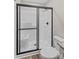 Bathroom with glass enclosed walk-in shower, modern fixtures, and tile floor at 630 W Bell St, Statesville, NC 28677