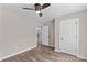 Cozy bedroom with hardwood floors, ceiling fan, walk-in closet and large window at 630 W Bell St, Statesville, NC 28677