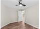 This bedroom features sleek wood-look flooring and a modern ceiling fan for a stylish, comfortable space at 630 W Bell St, Statesville, NC 28677