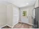 Kitchen featuring a pantry, and stainless appliances with hardwood flooring at 630 W Bell St, Statesville, NC 28677