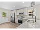 Kitchen featuring light cabinets, granite countertops, and stainless appliances at 630 W Bell St, Statesville, NC 28677