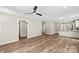 Open-concept living area with hardwood floors and access to the kitchen at 630 W Bell St, Statesville, NC 28677