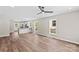Open-concept living area with hardwood floors and view of the kitchen at 630 W Bell St, Statesville, NC 28677