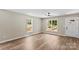 Bright living room with wood floors, neutral walls, and natural lighting at 630 W Bell St, Statesville, NC 28677