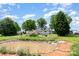 Tranquil backyard with a scenic pond and lush landscaping at 6362 Sherrills Ford Rd, Catawba, NC 28609