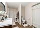 Bathroom with modern vanity, toilet, shower with curtain and storage space at 6362 Sherrills Ford Rd, Catawba, NC 28609