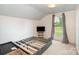 Minimalist bedroom with bed frame, large window, and neutral carpet at 6362 Sherrills Ford Rd, Catawba, NC 28609