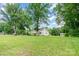 Expansive lawn with mature trees surrounds this classic two-story farmhouse property at 6362 Sherrills Ford Rd, Catawba, NC 28609