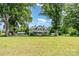 A charming home with a large yard and mature trees, including a covered parking area at 6362 Sherrills Ford Rd, Catawba, NC 28609