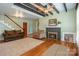 Cozy living room with beamed ceiling, fireplace, hardwood floors, and plenty of natural light at 6362 Sherrills Ford Rd, Catawba, NC 28609