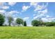 A house on a manicured lawn with a backdrop of a beautiful sky at 6362 Sherrills Ford Rd, Catawba, NC 28609