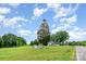 A beautiful property with a lush lawn, clear sky, and mature trees at 6362 Sherrills Ford Rd, Catawba, NC 28609