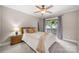 Cozy bedroom with a queen bed, wooden accents, and a sliding door that opens to the outdoors at 7 Turtle Ln, Clover, SC 29710