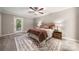 Cozy bedroom featuring a comfortable queen-sized bed, neutral decor, and direct access to the outdoors at 7 Turtle Ln, Clover, SC 29710