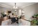 Stylish dining room with hardwood floors, modern lighting and easy access to the kitchen and living areas at 7 Turtle Ln, Clover, SC 29710