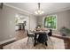 Dining area with hardwood floors, modern lighting and a view of the backyard, seamlessly connecting to other living spaces at 7 Turtle Ln, Clover, SC 29710