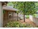 Home exterior with a covered porch and lush greenery, offering a serene and private outdoor space at 7 Turtle Ln, Clover, SC 29710