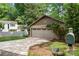 Two car garage with stone and horizontal siding and a concrete driveway at 7 Turtle Ln, Clover, SC 29710