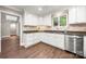Bright kitchen featuring white cabinetry, stainless steel appliances, and a view to the dining area at 7 Turtle Ln, Clover, SC 29710