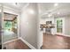 Bright kitchen view from hallway, showcasing white cabinetry and stainless steel appliances at 7 Turtle Ln, Clover, SC 29710