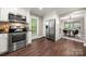 Modern kitchen equipped with stainless steel appliances and a view to the dining and backyard at 7 Turtle Ln, Clover, SC 29710