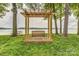 Lakeside swing bench under a wooden pergola with a view of the water at 7 Turtle Ln, Clover, SC 29710
