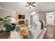 Cozy living room featuring a stone fireplace, hardwood floors, and a comfortable couch for relaxing evenings at 7 Turtle Ln, Clover, SC 29710