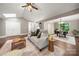 Open-concept living space with hardwood floors, a comfortable couch and easy access to the dining area at 7 Turtle Ln, Clover, SC 29710