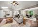 Bright living space with hardwood floors, a comfortable sofa and easy access to the dining area at 7 Turtle Ln, Clover, SC 29710