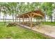 Lakeside wooden pavilion on a grassy field with picnic tables and lake views at 7 Turtle Ln, Clover, SC 29710