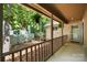 Covered porch showcasing stone accents, decorative hanging plants, and a tranquil outdoor retreat at 7 Turtle Ln, Clover, SC 29710