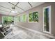 Bright sunroom with large windows, ceiling fan, and access to outdoor seating area, perfect for relaxing at 7 Turtle Ln, Clover, SC 29710